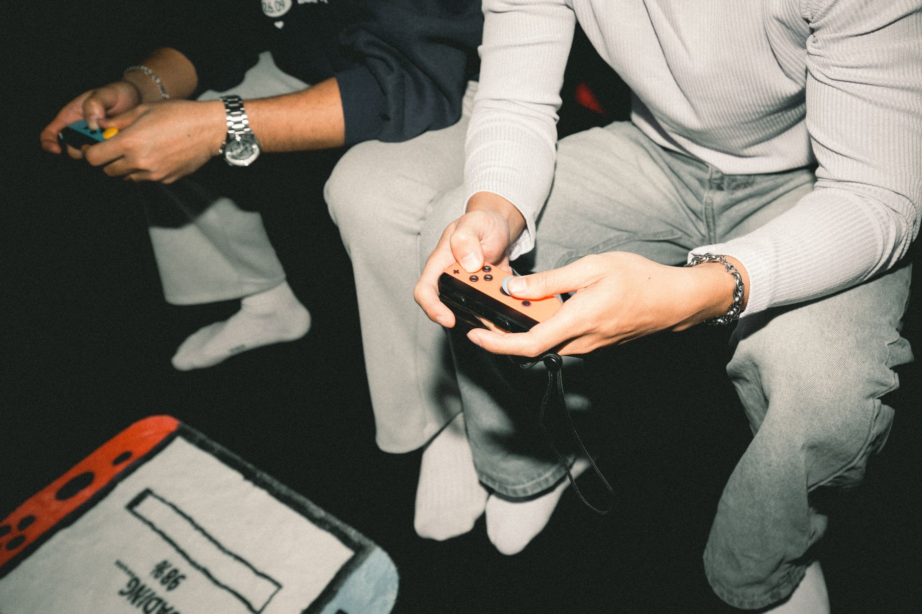 Two adults enjoying a video game session together, focused on controllers. — bplay666 Provides Online Betting Opportunities f