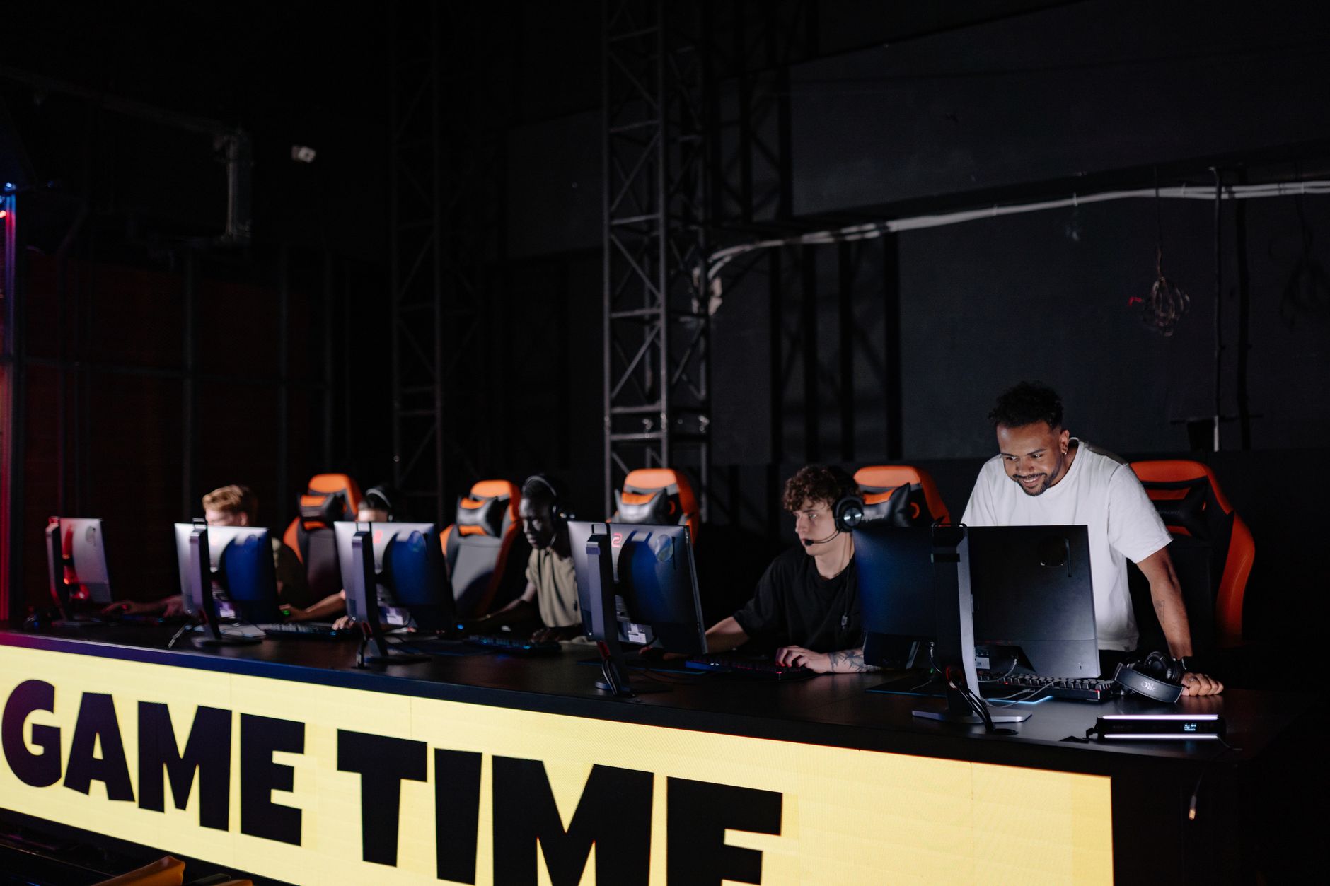 Esports team engaged in competitive gaming session indoors, showcasing teamwork and concentration. — Casino Sites with the Be