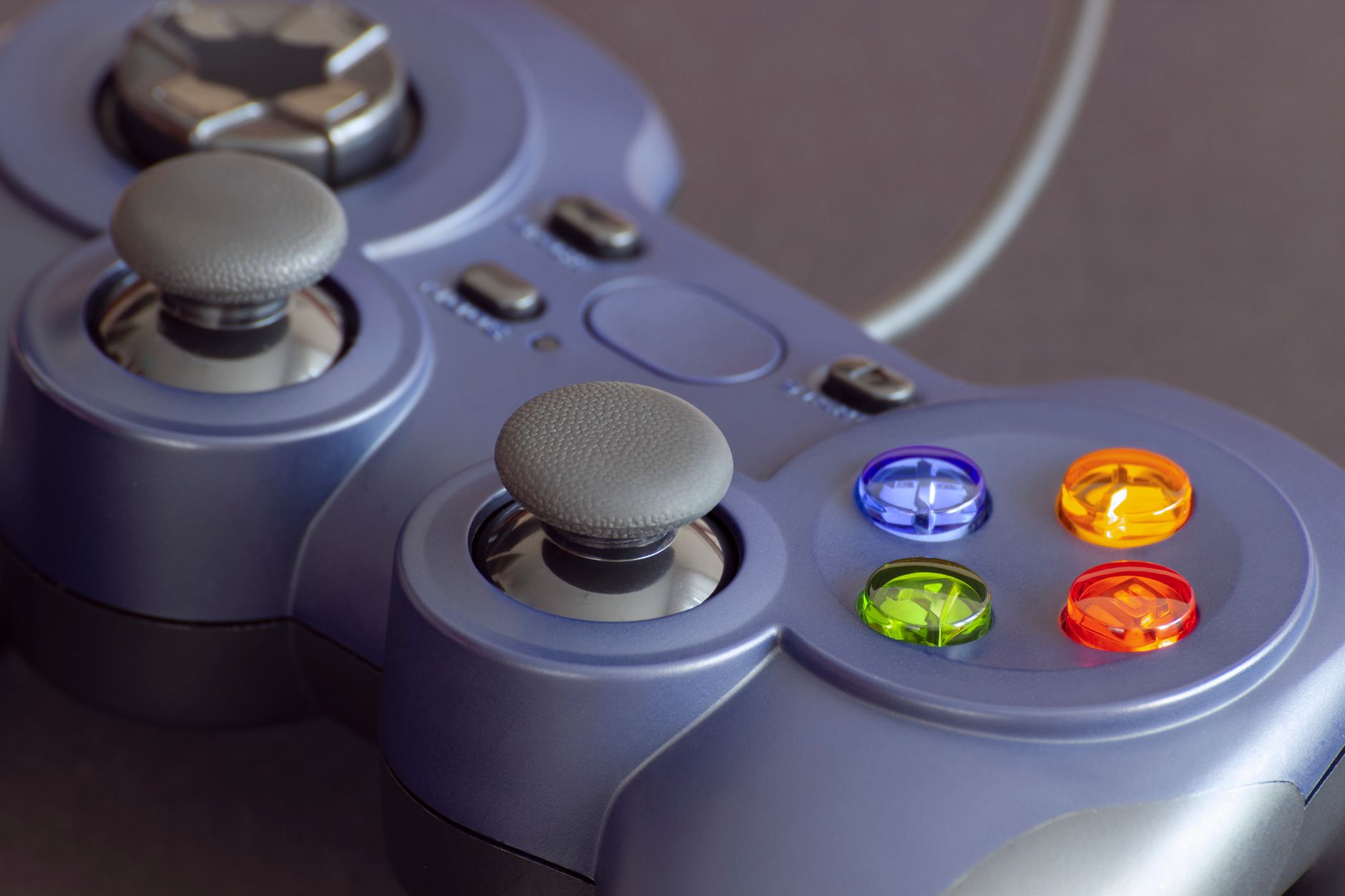 Detailed close-up of a gaming controller emphasizing its vibrant buttons. — Experience the Future of Gaming at PHFUN: Where I