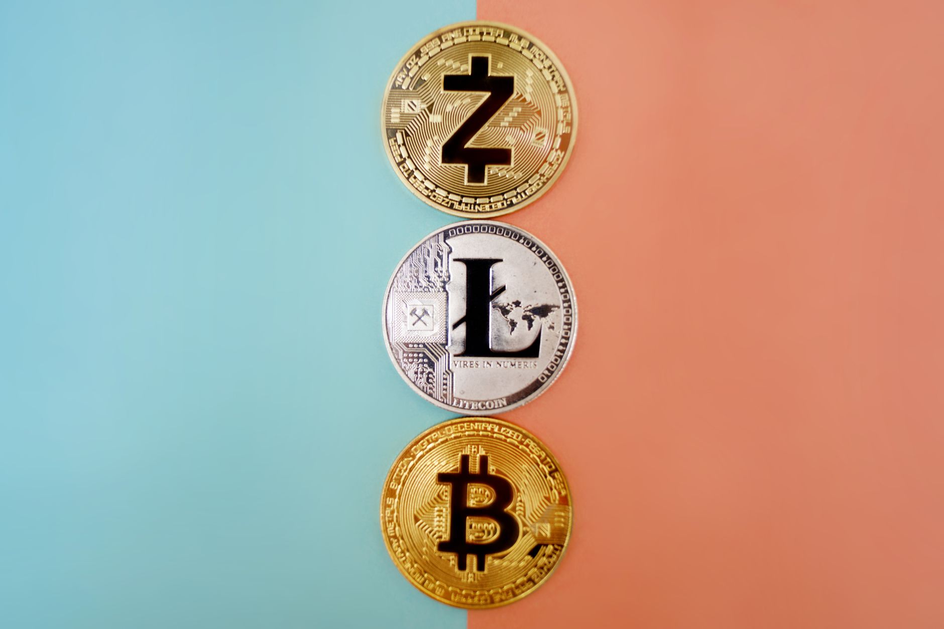 Colorful display of Zcash, Litecoin, and Bitcoin coins on gradient background. — How to Use Crypto for Royalty Payments