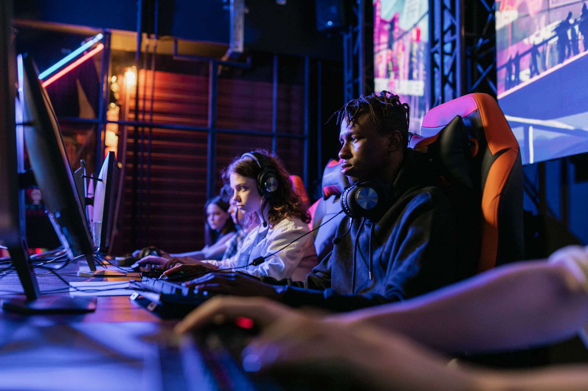 Serious gamers engage in a competitive esports event, highlighting focus and teamwork. — Practical Tips to Improve Your Daman