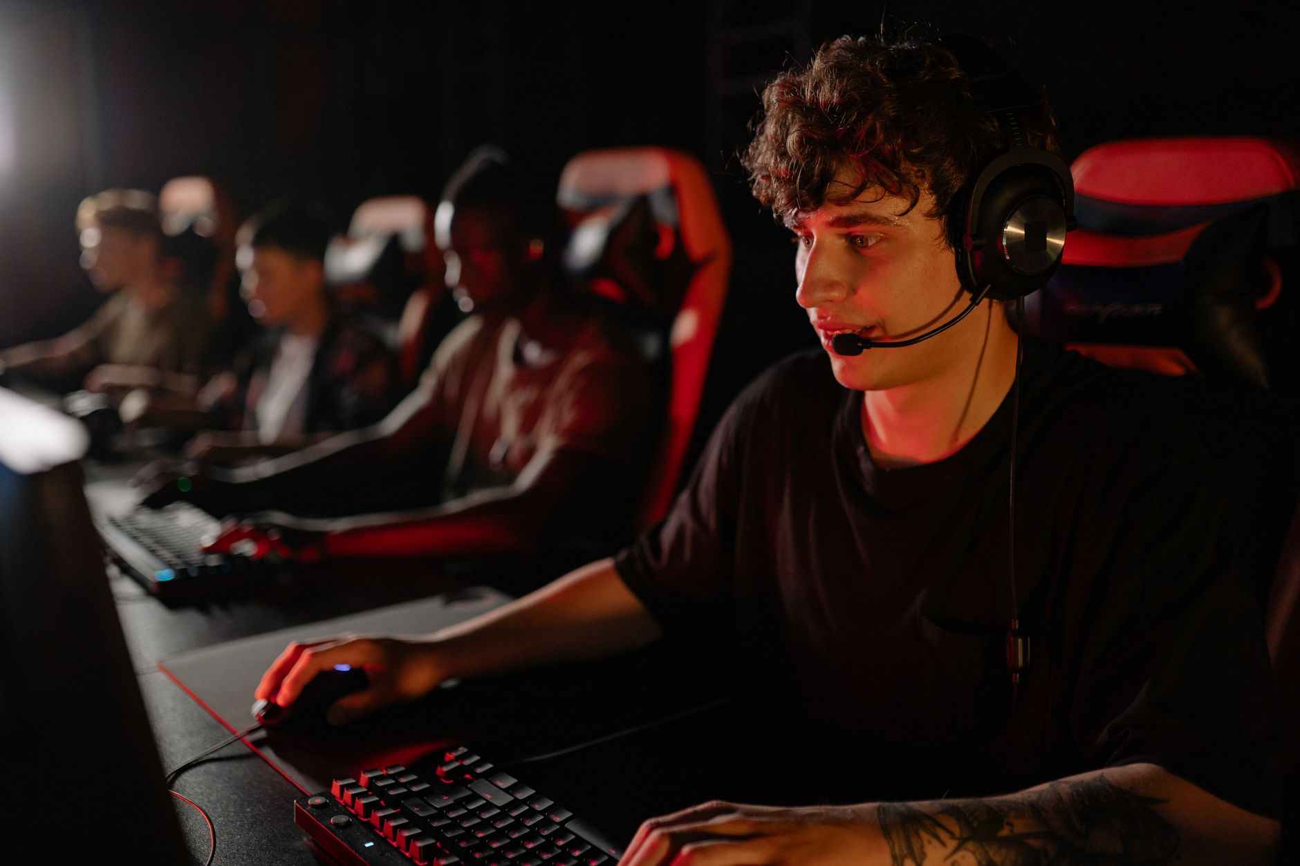 A dedicated team of young gamers engaging in a competitive esports tournament. — Slot88: Engaging Themes and Immersive Graphi