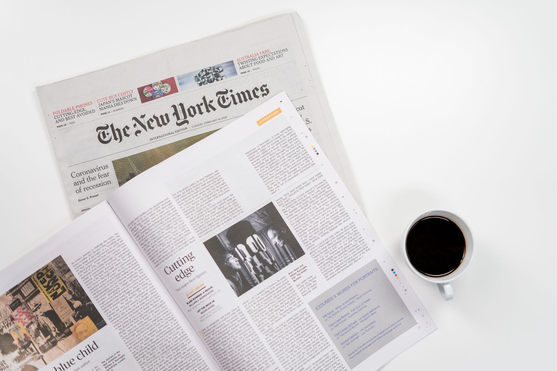 Flat lay of a coffee cup and The New York Times newspaper, ideal for business and lifestyle themes. — Slot88: Unlock Endless