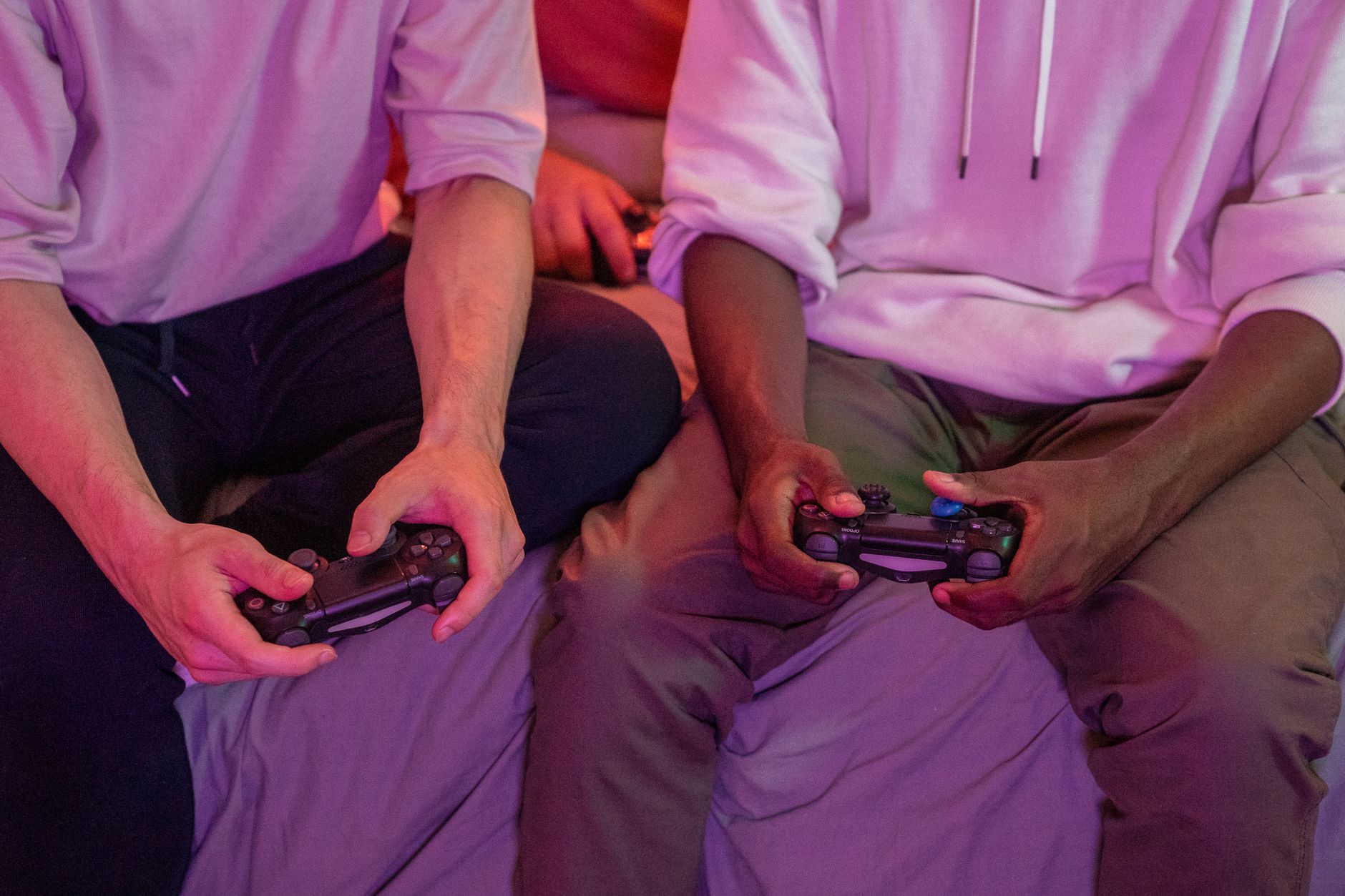 Two friends playing video games together at home, using controllers. — Slots Delivering Fast Gameplay and Easy Access to Big