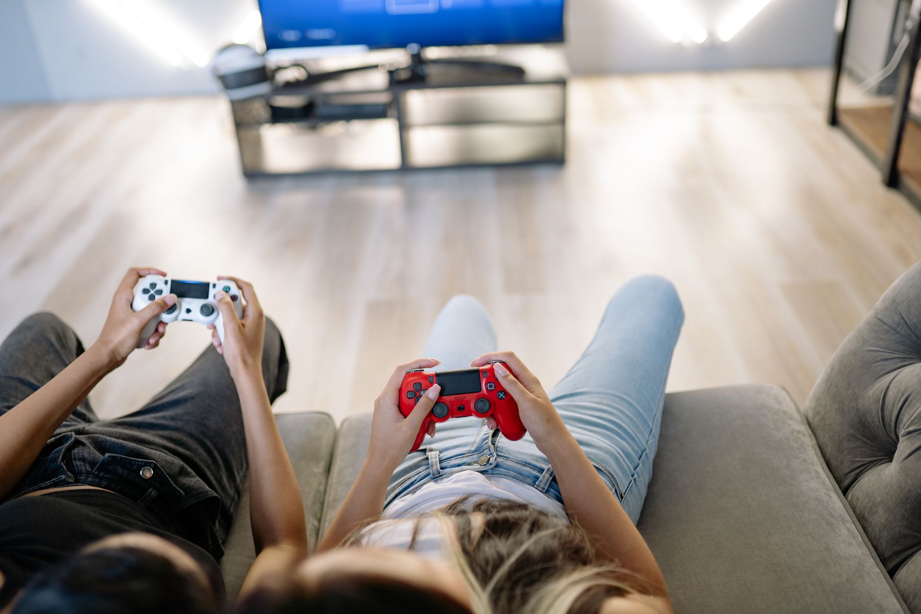 Two friends playing video games together indoors with game controllers. — Start Winning with Ufabet: Your Go-To Platform for