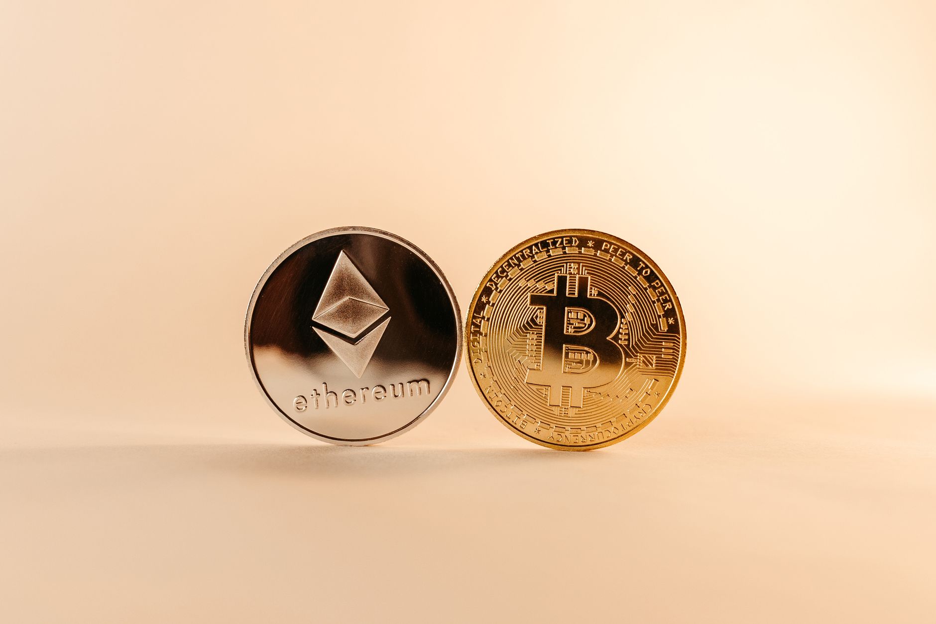 Close-up of Bitcoin and Ethereum coins symbolizing digital currency and blockchain technology. — The Effect of Macroeconomic