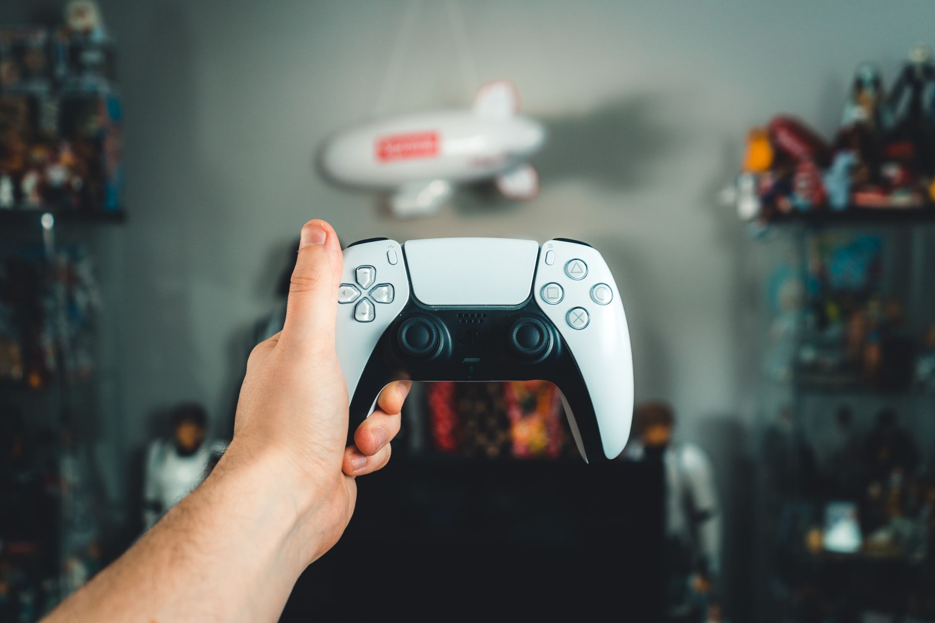 A close-up of a hand holding a sleek white gaming controller, showcasing modern design. — "Unlocking MPO007: A Guide to Safel